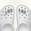 Jibbitz-skocharm med tallet 0